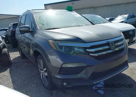 2018 Honda Pilot Touring z USA, uszkodzony, nr VIN 5FNYF5H98JB027001